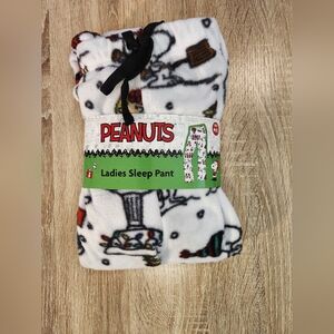 Peanuts women's Christmas Snoopy and Woodstock plush pajama pants. 